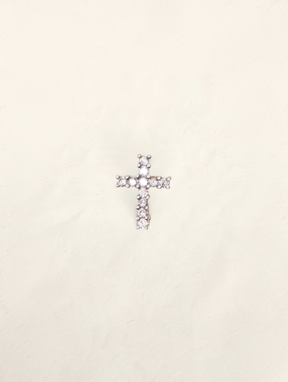 Zafrah 14k yellow gold mini cross pendant featuring 11 round brilliant cut diamonds set in a delicate design.
