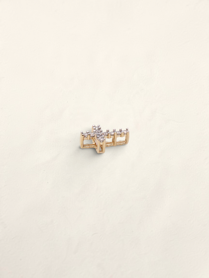 Zafrah 14k yellow gold mini cross pendant featuring 11 round diamonds in a delicate, polished setting.