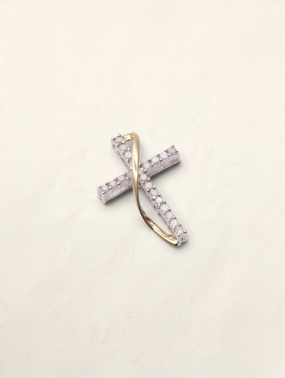 Zafrah 10K two-tone gold small cross pendant featuring 0.2ctw round diamond accents in a delicate twisted design.