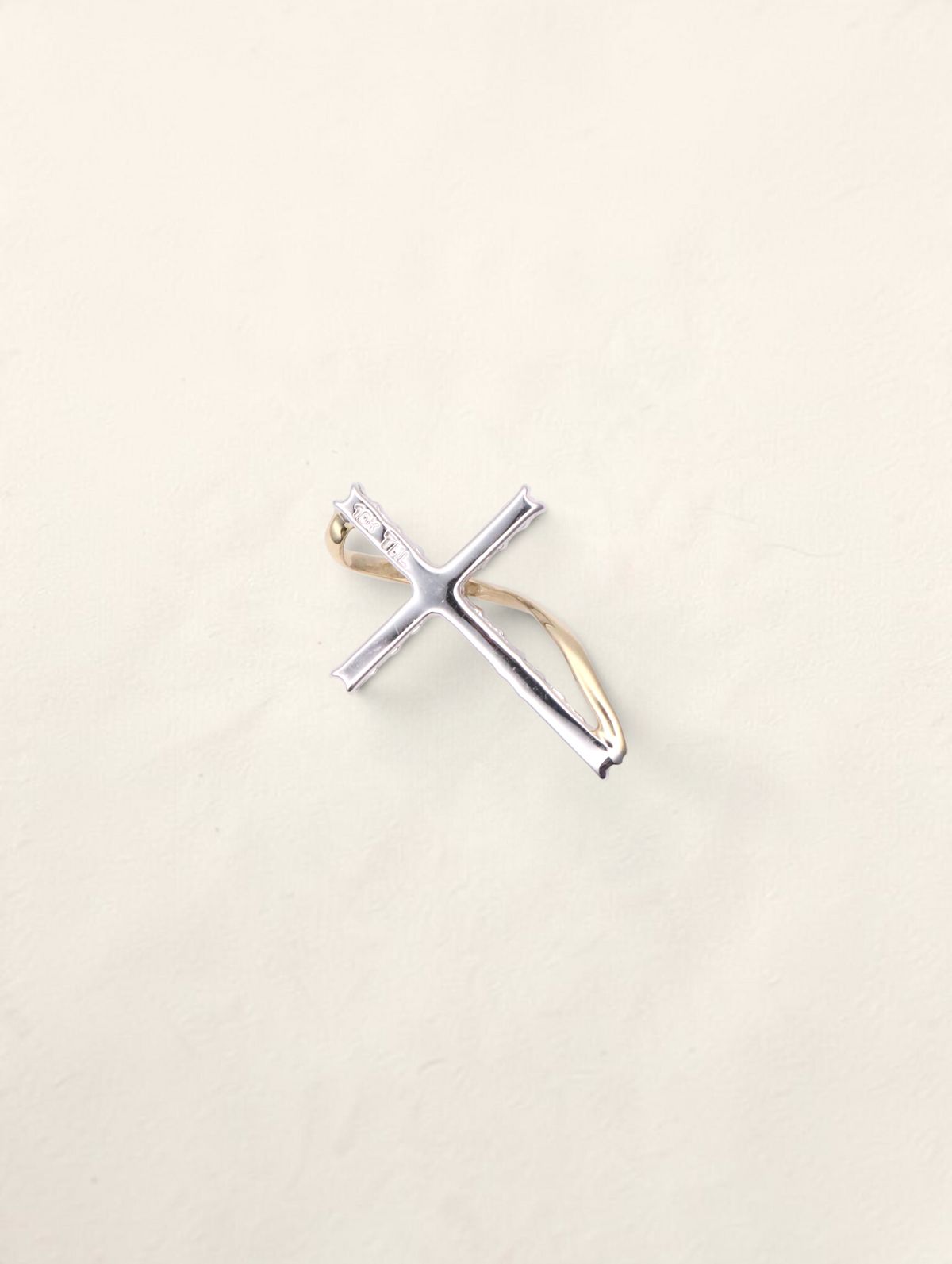 Zafrah 10K two-tone gold small cross pendant featuring 0.2ctw round diamonds in a delicate, elegant design.