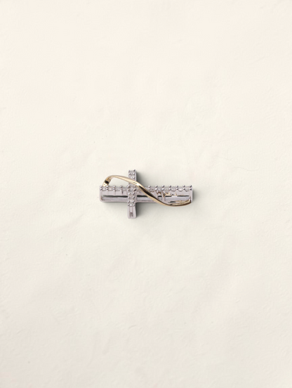 Zafrah 10K two-tone gold small cross pendant featuring 0.2ctw round diamonds in a delicate twisted design