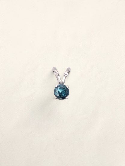 Zafrah 14k white gold solitaire pendant featuring a round 0.21ct blue diamond on a simple prong setting