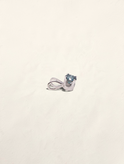 Zafrah 14k white gold solitaire pendant featuring a round blue diamond in a classic prong setting