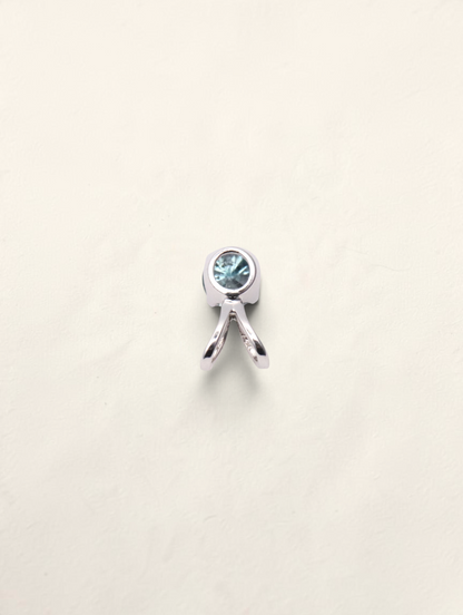 Zafrah 14k white gold solitaire pendant featuring a round blue diamond in a polished bezel setting.