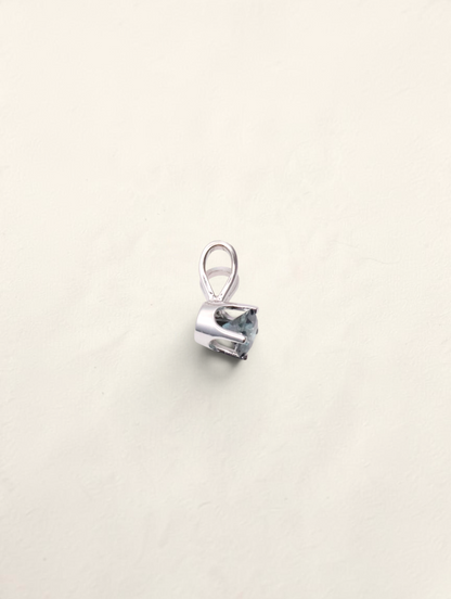 Zafrah 14k white gold solitaire pendant featuring a 0.21ct round blue diamond in a classic prong setting